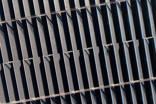 Aerial view of the repeating roof structure of an old warehouse in Warszawa, Poland.