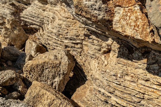 Layered limestone formation with large boulders texture in Budva, Montenegro