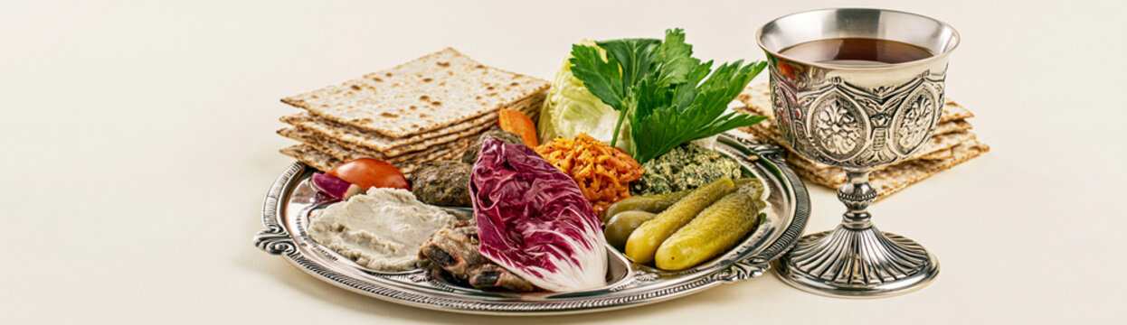 Traditional Seder plate with symbolic foods and matzah for Passover