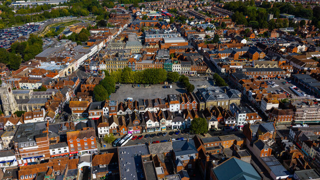Aerial view of the historic market square surrounded by traditional brick buildings and narrow streets in Salisbury, England, United Kingdom.
