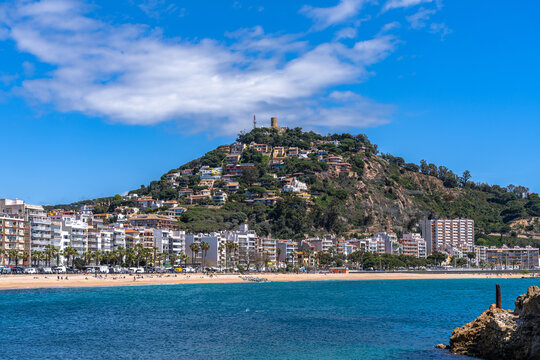 Beautiful view of mountain Sant Joan with the castle and Blanes beach at Costa Brava coast in summer on sunny day, Selva, Girona Catalonia, Spain