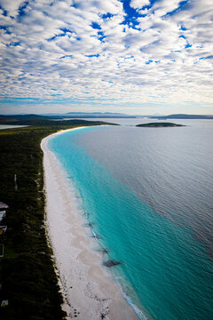 Aerial view of Mistaken Island Nature Reserve featuring turquoise waters, a white sand beach, and lush coastal vegetation in City of Albany, Western Australia, Australia.