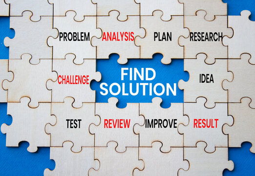 Find solution symbol. Concept words find solution on wooden puzzle pieces over blue background. Idea puzzle piece. Problem solving concept. Copy space.