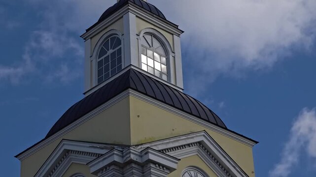 Russia, St. Petersburg, August 8, 2020 A clock tower with a weather vane on top, perfect for cityscapes or architectural illustrations