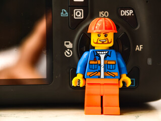 Fototapeta premium Russia, St. Petersburg, August 8, 2020 A close up shot of a Lego man posing in front of a camera, a playful and creative scene