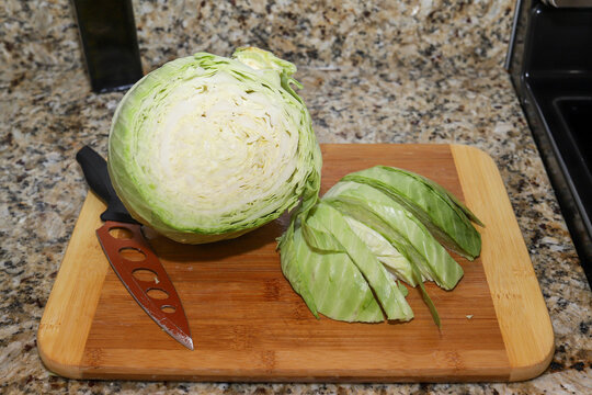Fresh organic cabbage on a wooden cutting board