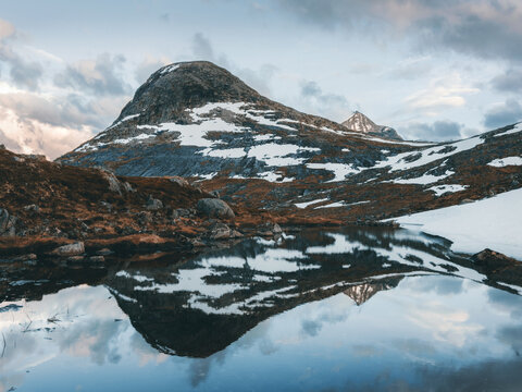 Mountains and lake mirror water reflection landscape in Norway nature scenic view, travel nordic destinations beautiful offbeat places in Scandinavia tranquil scenery