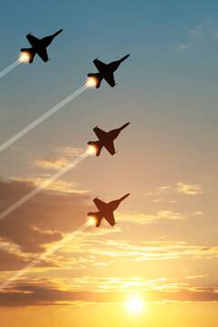 Air Force Day. Aircraft silhouettes on background of sunset. Combat flight of interceptors on a mission. Vertical poster.