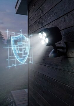 Modern outdoor security camera projecting a digital shield blueprint