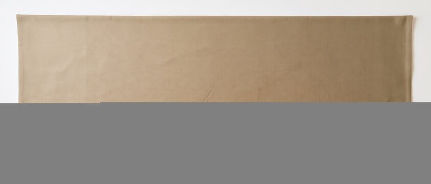 Linen tablecloth with a woven fabric texture and soft creases, creating a muted earth-tone background with copy space for a banner