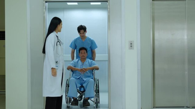 Hospital doctor nurse patient wheelchair elevator corridor healthcare calm scene as doctor walks from lift while caregiver guides seated man along bright clinic hallway care