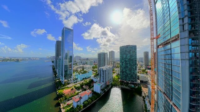 Aerial rise to reveal a developing city