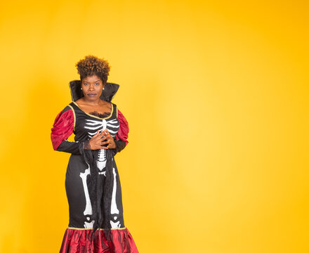 Woman celebrating halloween wearing vampire skeleton costume