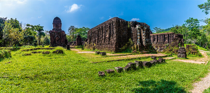 A view looking back across the ancient Hindu temple ruins of the My Son Sanctuary located in Quang Nam Province, Vietnam on a bright sunny day