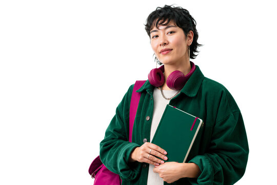 Young woman holding green notebook and wearing pink headphones around neck, isolated on transparent background. Student, education, lifestyle, fashion.