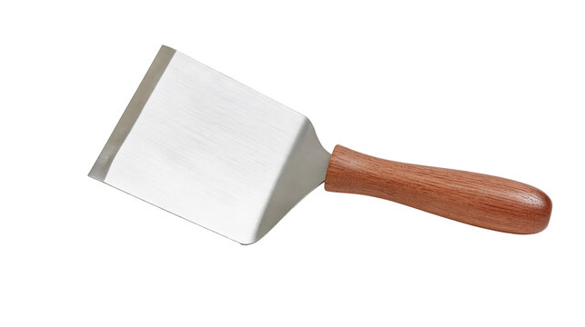 Isolated metal food turner with sturdy wooden handle, useful kitchen tool for cooking food