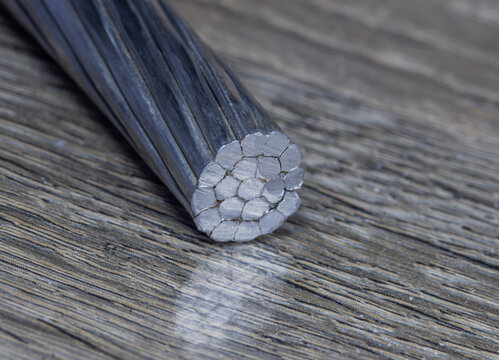 An aluminum conductor steel-reinforced (ACSR) bare overhead power line cable. A compacted stranded aluminum conductor