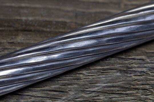 An aluminum conductor steel-reinforced (ACSR) bare overhead power line cable. A compacted stranded aluminum conductor