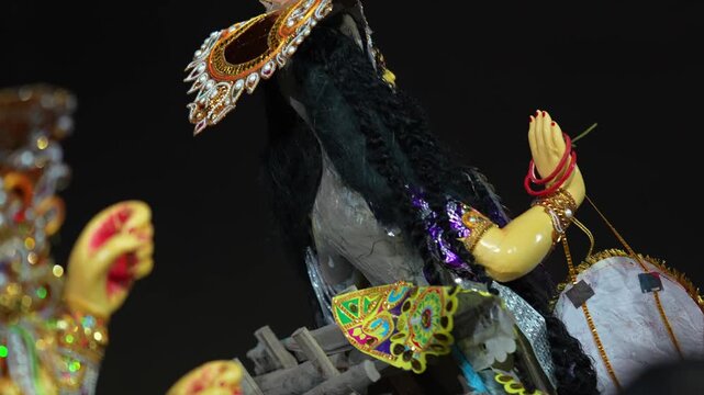 Traditional Durga Puja Visarjan scene showing a decorated Goddess Durga idol being taken for immersion as part of the festival's final ritual.