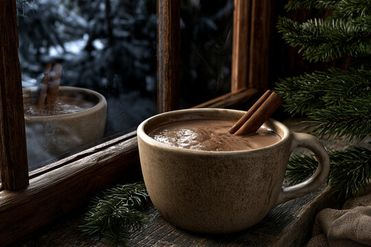 Christmas cocoa with cinnamon
and reflection
in window