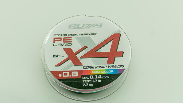 A fishing line spool is prominently displayed with various specifications highlighted, showcasing its product details and features