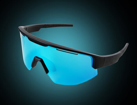 Sports glasses for extreme sports with blue lenses close up on a black background