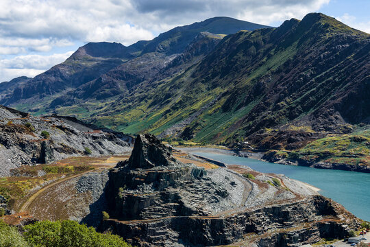 Dinorwic Slate Quarry terraces and Llyn Peris lake, Dinorwig near Llanberis, Mount Snowdon massif rising steeply in background, North Wales