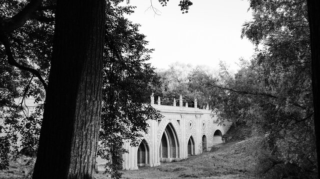 An old brick bridge built during the kingdom era. Black and white background.