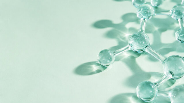 glass molecular model rests on a mint surface. Bright shadows create a scientific background with copy space. Chemistry innovation concept for education and design