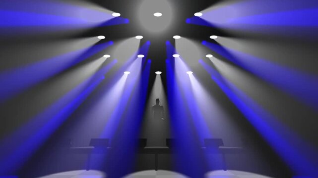 Stage lighting setup with bright beams illuminating a dark background, showcasing a gradual transition of light intensity and color from white to red, creating a dynamic visual atmosphere for a concer