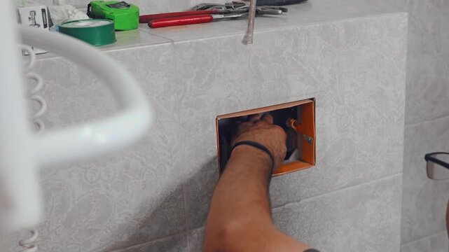 Installing and connecting the internal flushing system inside a concealed toilet cistern
