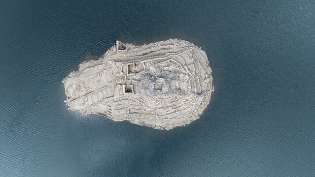 Aerial view of the ancient Castro Candaz archaeological site surrounded by the waters of the Mino River in Belesar, Lugo, Spain.