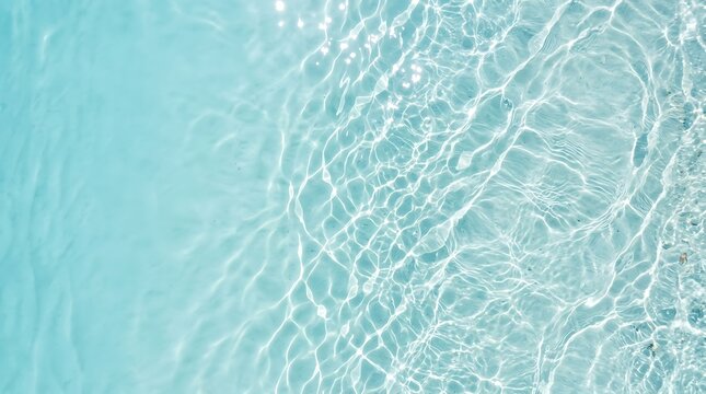 Crystal clear turquoise water surface with gentle ripples and sunlight reflections, creating a beautiful natural background texture for summer themes