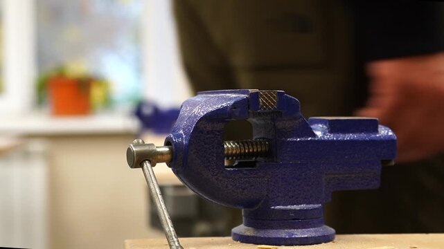 Vise, locksmith tool, blue in color.