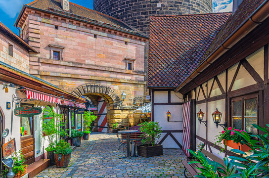 Nuremberg, Germany, July 15, 2024: Old town Nuremberg city historical center Craftsmen's Courtyard medieval village Handwerkerhof Nurnberg with traditional houses, typical buildings on cobbled street
