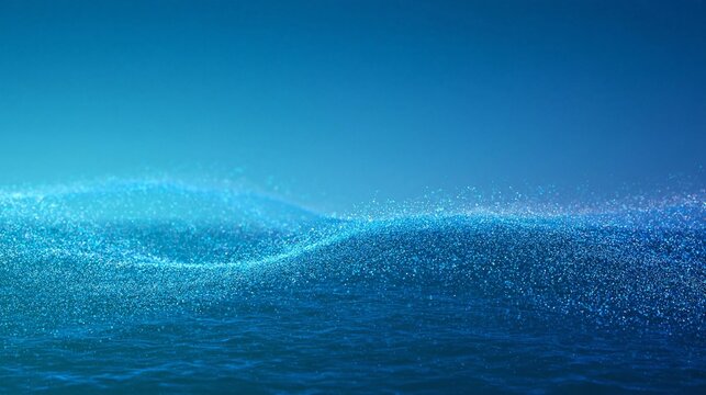 Close-up of a wave-like object that appears to be floating on the surface of the water. the wave is made up of small particles that are scattered across the image, creating a sparkling effect.