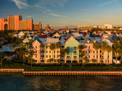 New Providence, The Bahamas - 03 January 2026: Aerial view of Paradise Island with colorful resort buildings, palm trees, and calm water under a clear sky.