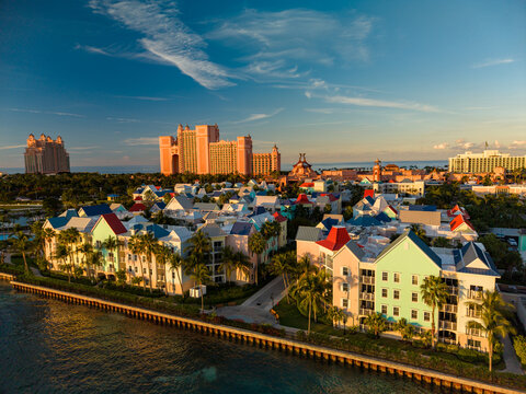 New Providence, The Bahamas - 03 January 2026: Aerial view of Paradise Island with its colorful buildings and the iconic Atlantis resort in the background under a clear blue sky.