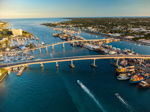 New Providence, The Bahamas - 03 January 2026: Aerial view of Paradise Island with bridges connecting to the harbor, numerous boats docked at the marina, and calm turquoise waters under a clear sky.