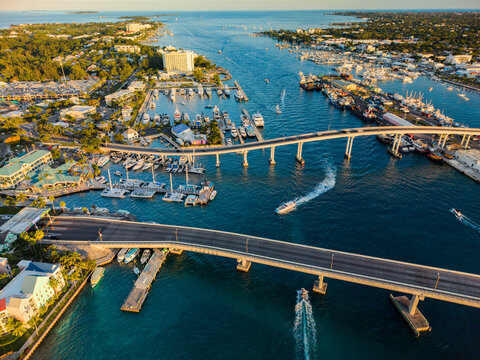 New Providence, The Bahamas - 03 January 2026: Aerial view of Paradise Island harbor with boats docked at the marina, two bridges crossing the water, and surrounding buildings.