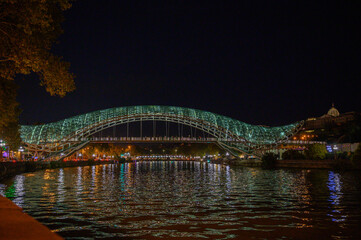 Night stock photo of the Bridge of Peace in Tbilisi over the Kura river © Михаил Шорохов