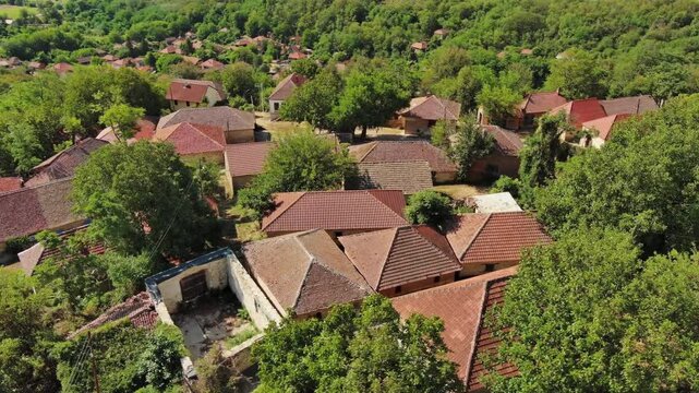 Aerial around view of old rustic vintage houses with wine cellars in Rogljevacke pivnice in Negotin region of Serbia, 4k