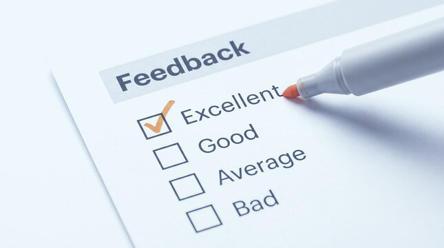 Feedback survey form marked with orange pen on white paper checklist for customer satisfaction evaluation and corporate quality assessment.