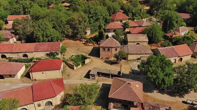 Aerial around view of old rustic vintage houses with wine cellars in Rogljevacke pivnice in Negotin region of Serbia, 4k