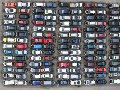 Dandenong, Australia - 13 September 2026: Aerial view of Jollys Auto Parts Dandenong showing rows of salvaged cars parked in an outdoor lot.