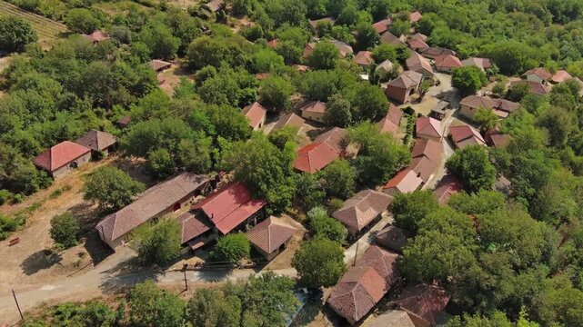 Aerial view of old rustic vintage houses with wine cellars in Rogljevacke pivnice in Negotin region of Serbia, 4k
