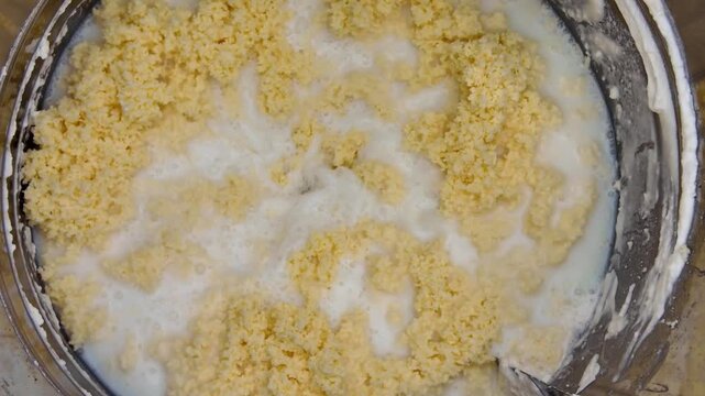 Butter Separating From Buttermilk During Churning Process