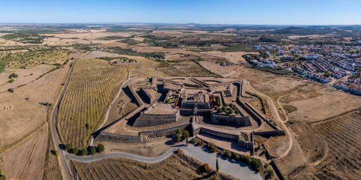 Elvas, Portugal - 10 September 2026: Aerial view of Forte de Nossa Senhora da Graca, a star-shaped fortress surrounded by dry fields and rural landscape.