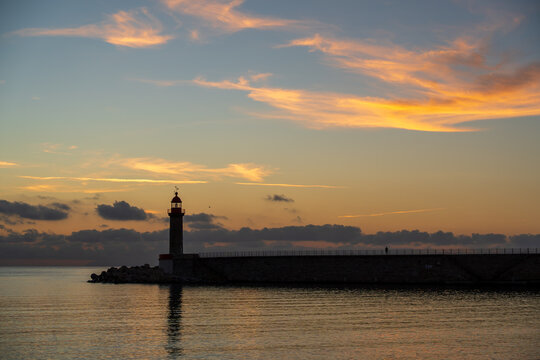 famous red lighthouse at dawn, located at the entrance to the old port of Bastia in Corsica, France.