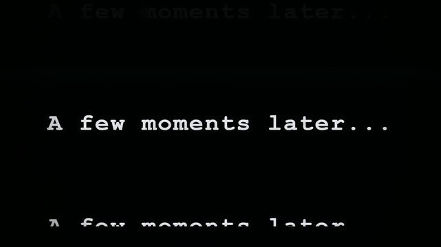 White text appearing on black background saying a few moments later for video transition